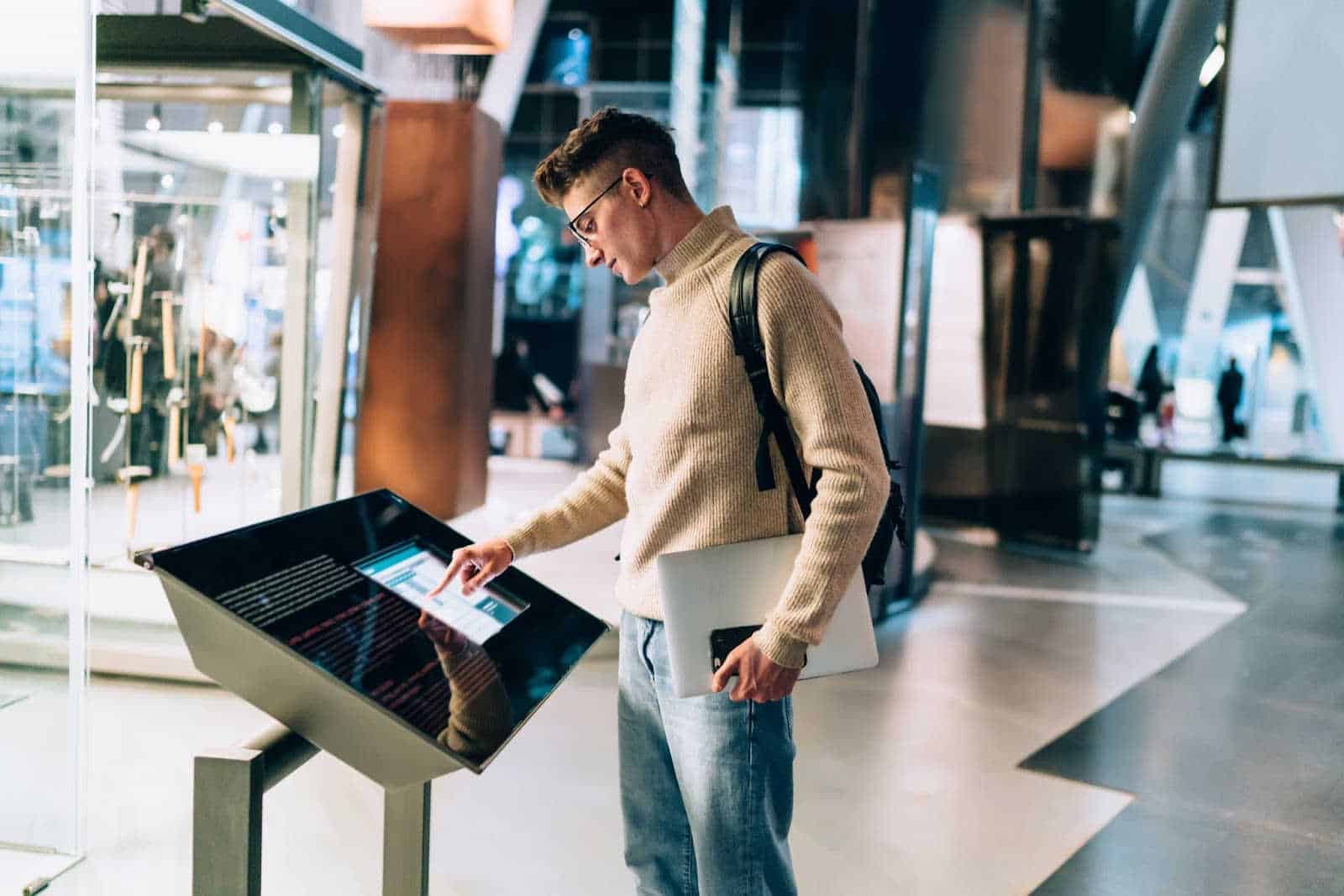 Man browsing a touch screen terminal