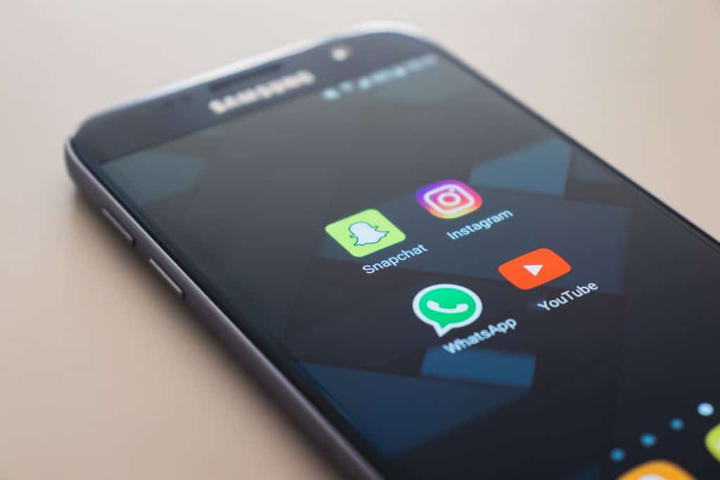 Image of phone with social media app icons
