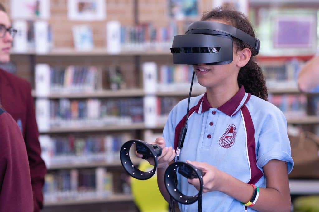 Photograph of girl using virtual reality equipment