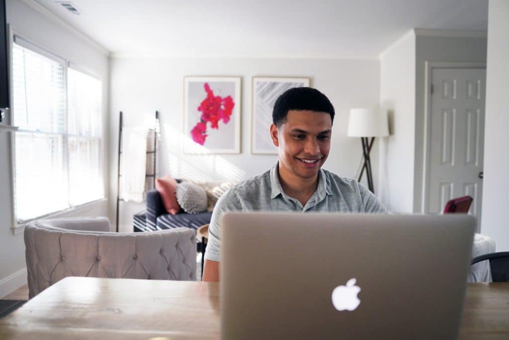 Image of a person using a Macbook laptop.